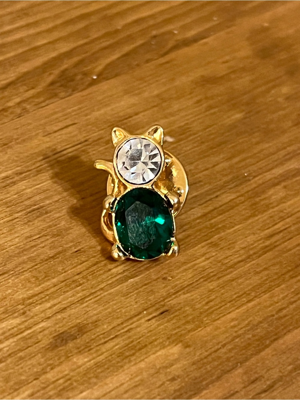 Green and clear crystal cat tie tack on gold tone backing with tack 3/4”